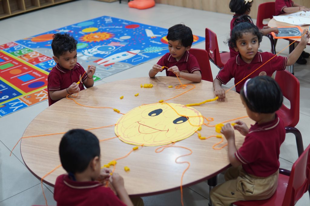 Children working together on a creative learning activity in the classroom