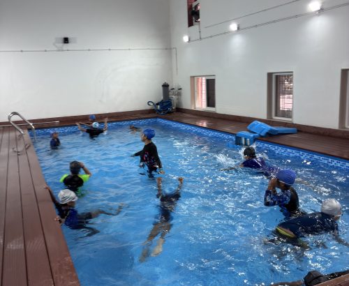 Children participating in a swimming activity at school